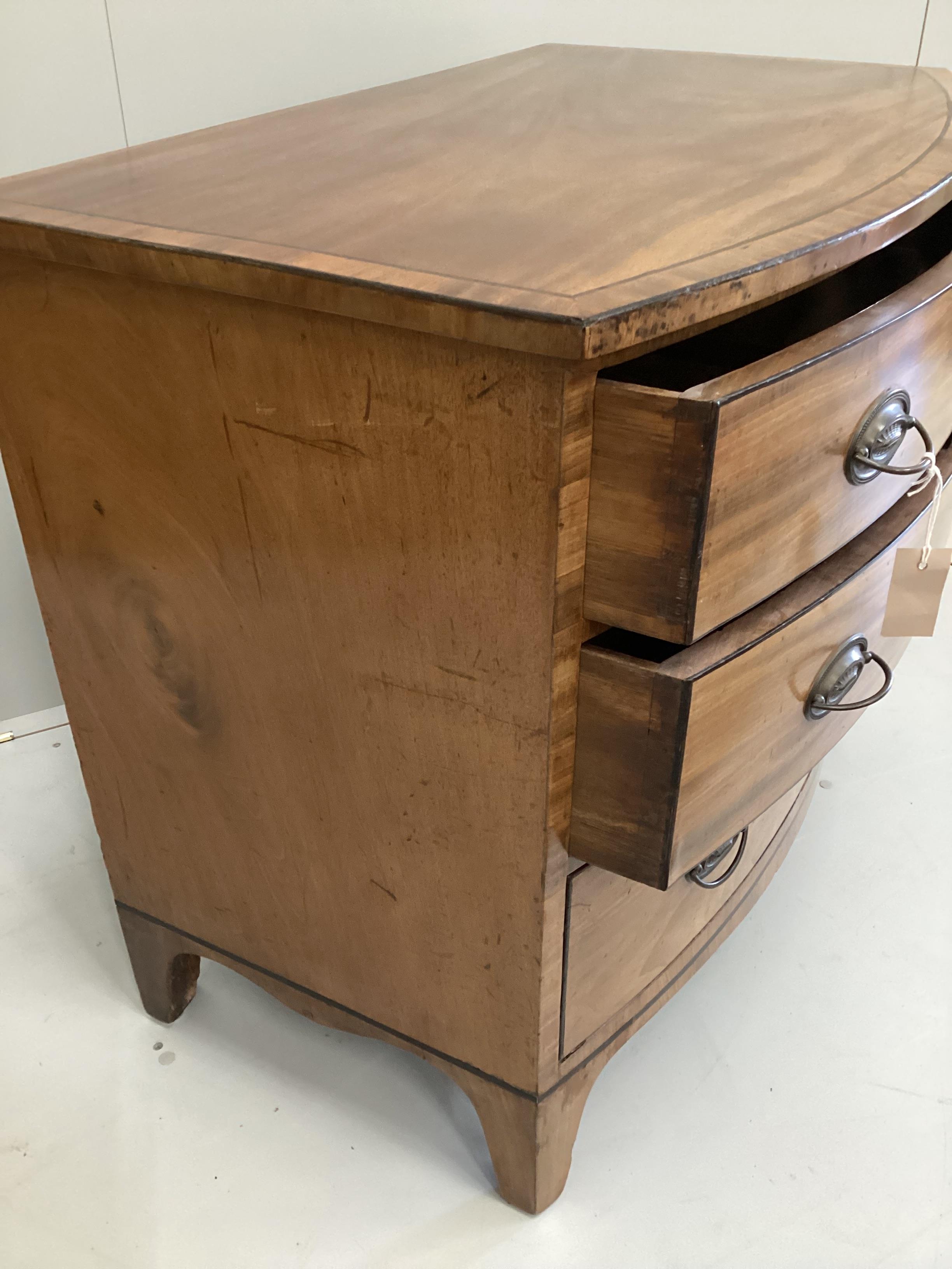 A small Regency banded mahogany bowfront three drawer chest, width 95cm, depth 57cm, height 80cm